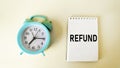 The word RETURN on a notepad , near an alarm clock Royalty Free Stock Photo