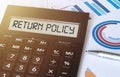 Word return policy on calculator. Business and finance concept