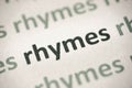 Word rhymes printed on paper macro Royalty Free Stock Photo