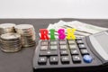 The word `risk` is folded with letters / calculator / stacks of coins and dollars. Close-up. The concept of business risk, economi Royalty Free Stock Photo