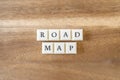 The word Road Map on a wooden background.