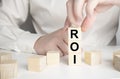 Word ROI Return on Investment made with wood building blocks Royalty Free Stock Photo