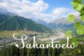 Word Sakartvelo as native name of Georgia against beautiful mountain landscape