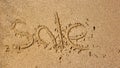 Word sale handwritten in sand Royalty Free Stock Photo