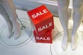 The word sale in shop window of clothing store Royalty Free Stock Photo