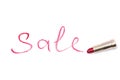 Word sale, written with red lipstick in golden tube on white isolated background Royalty Free Stock Photo