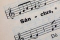 The word Sanctus on a page of an old prayer and hymn book Royalty Free Stock Photo