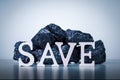 Word SAVE with Coal Stack. Royalty Free Stock Photo
