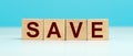 Word SAVE made with cube wooden block