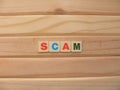 Word Scam on wood