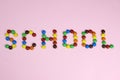 Word School of colored candies on a pink background Royalty Free Stock Photo