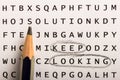 Word search, puzzle. Concept about finding, keep looking, persistence. Royalty Free Stock Photo