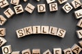 The word skills wooden cubes with burnt letters Royalty Free Stock Photo