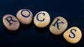 Word socks spelt with pebbles Royalty Free Stock Photo