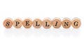 Word Spelling from circular wooden tiles with letters children toy.