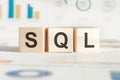 The word SQL structured query language, lined with wooden blocks. Wooden block with words SQL - Structured Query Language Royalty Free Stock Photo