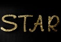 Word `Star`created out of gold mirrored letters