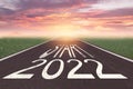 The word start 2022 written on asphalt road at sunrise, New life change 2022 plan concept, Concept for new year 2022