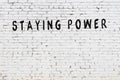 Word staying power painted on white brick wall Royalty Free Stock Photo