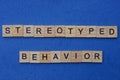 Word stereotyped behavior made from brown wooden letters