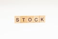 Word STOCK made of wooden blocks on white background