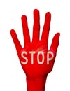 Word stop written on a hand palm colored in red, on white
