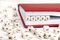 Word Story written in wooden blocks in red notebook on white woo Royalty Free Stock Photo