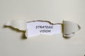 The word strategic vision appearing behind torn paper Royalty Free Stock Photo