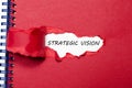 The word strategic vision appearing behind torn paper Royalty Free Stock Photo
