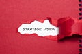The word strategic vision appearing behind torn paper Royalty Free Stock Photo