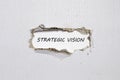 The word strategic vision appearing behind torn paper Royalty Free Stock Photo