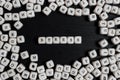 Word STRESS on wooden cubes on a black wooden table Royalty Free Stock Photo