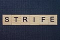 word strife from gray wooden letters