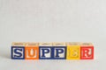 The word supper spelled with alphabet blocks Royalty Free Stock Photo