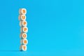 The word support on tiered wooden cubes against blue background Royalty Free Stock Photo
