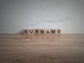 Word surname from wooden blocks