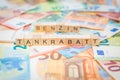 The word Tankrabatt - in German for Fuel discount - and Benzin - in German for Gasoline - in the background on banknotes Euro note