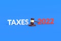 Word taxes 2022 near wooden judge hammer on blue background. Lawyer services