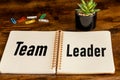 the word team leader written in a business notebook on the boss desk, Business concept, close up