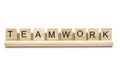 Word ``teamwork`` on scrabble wooden letters on a rack Royalty Free Stock Photo