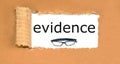 the word text, evidence written on a torn cardboard box.