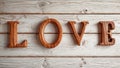 The word text LOVE is carved in wood Royalty Free Stock Photo