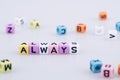 ALWAYS word text written on colorful cube with bokeh cube word b Royalty Free Stock Photo