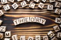 Word theory composed of wooden cubes with letters