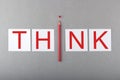 Word Think writing on white sheets of paper. Business, inspiration and creative concept Royalty Free Stock Photo