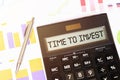 Word TIME TO INVEST plus on calculator. Business and tax concept Royalty Free Stock Photo