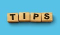 Word TIPS on wooden cubes with blue background 3d illustration Royalty Free Stock Photo