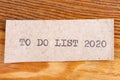 The word `to do list 2020` typed. The inscription on a gray sheet of pappier.