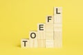 the word toefl is written on a wooden cubes, concept