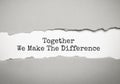 The word TOGETHER WE MAKE THE DIFFERENCE appearing behind torn brown paper Royalty Free Stock Photo